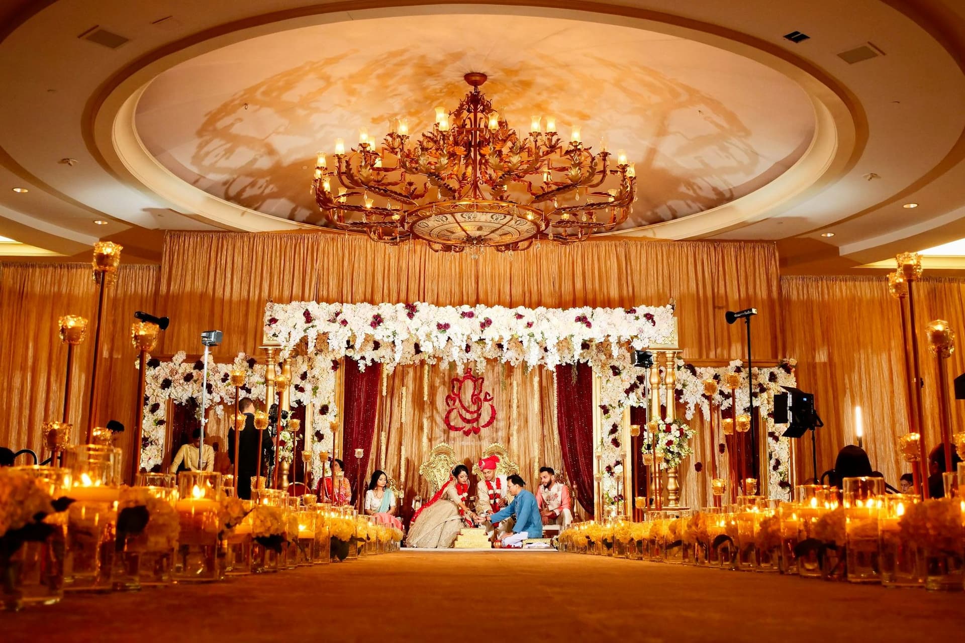 Decorated Indian wedding venue with floral ceiling work