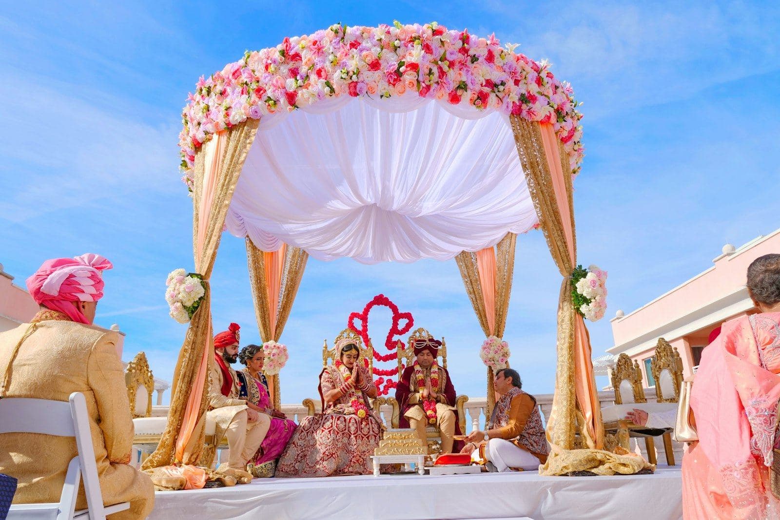 Guests seated under a decorated mandap